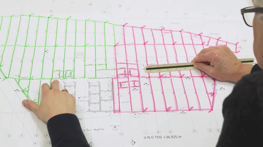 Drawing of steel frame with markings and highlighted steel members.