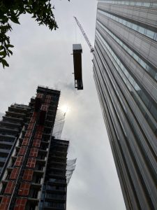 Steel hoop being lifted to the top of the building