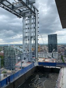 lifting steel hoop to the top of the building.